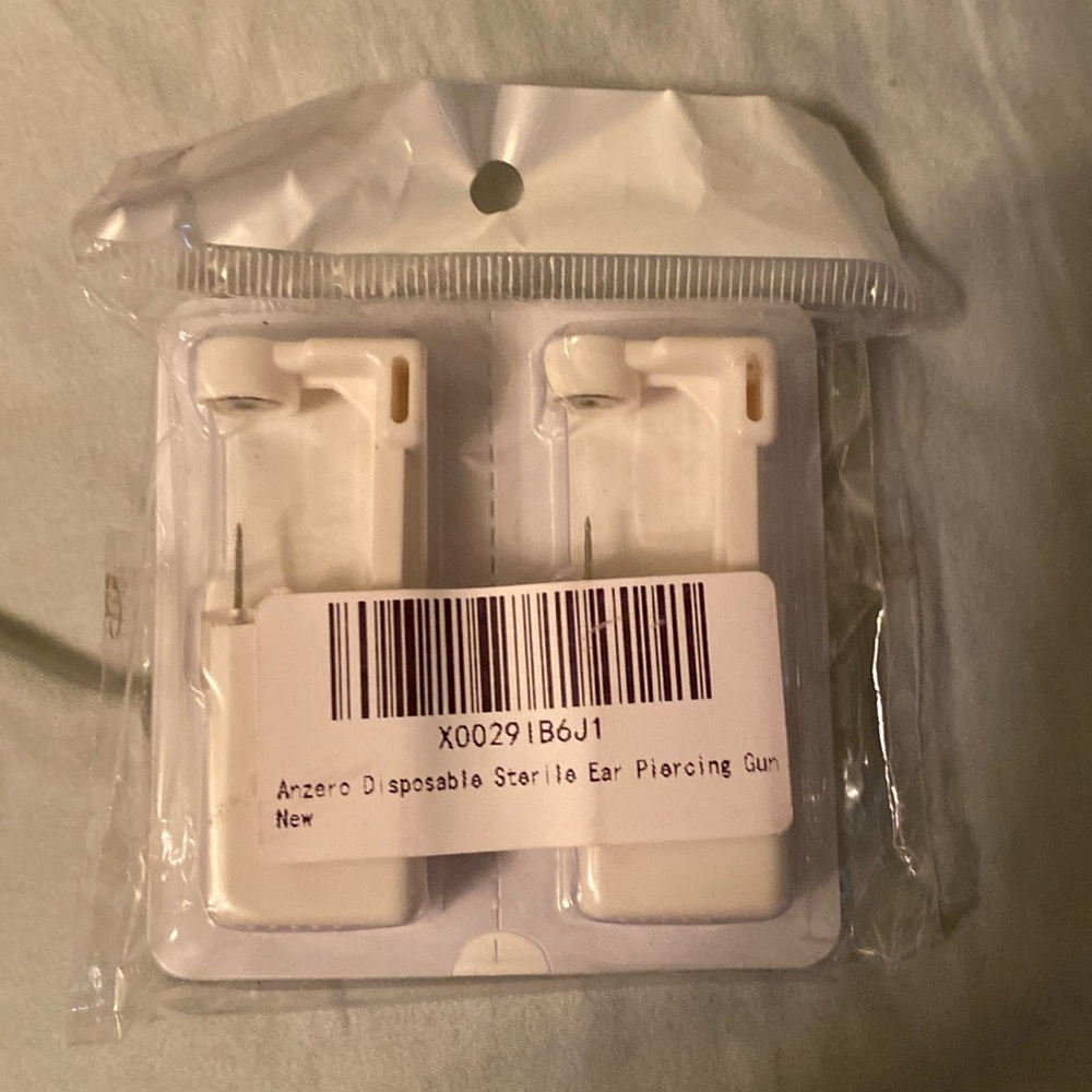 Disposable ear piercing set. One for each ear